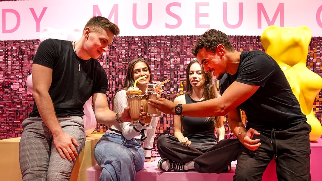 Visitors enjoying milkshakes at the Museum of Candy.