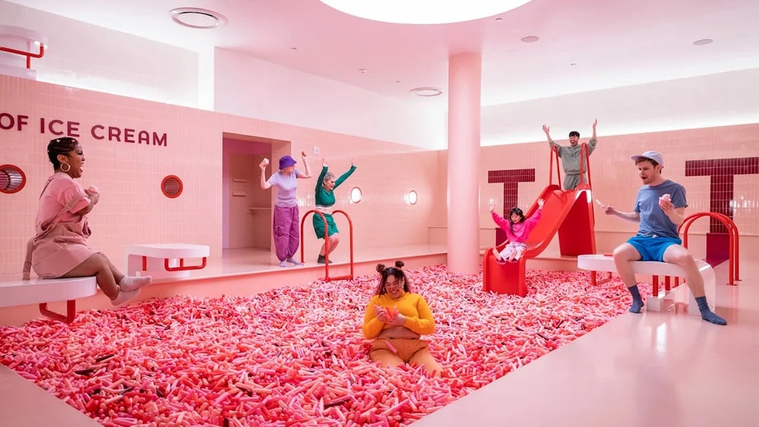 Visitors enjoying colorful exhibits at the Museum of Ice Cream in Singapore.