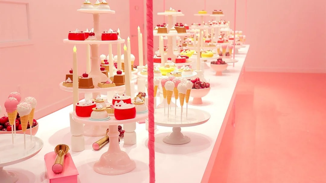 Five ice cream stations with diverse flavors in a vibrant pink market setting.
