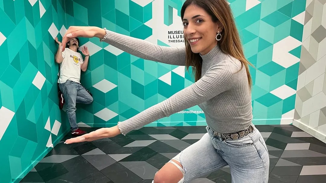 Visitors interacting with optical illusions at the Museum of Illusions Thessaloniki.