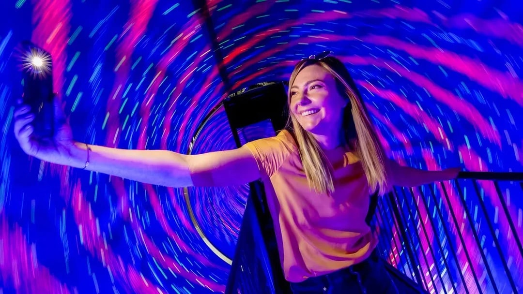 Person enjoying the Vortex Tunnel at Museum of Illusions Dubai.