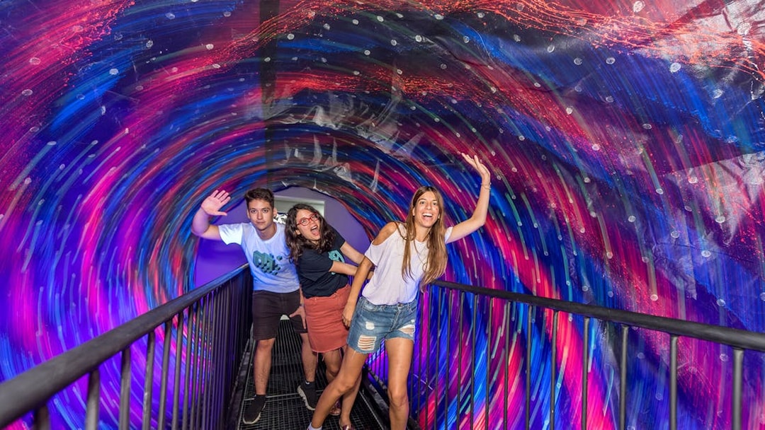 Visitors enjoying the vortex tunnel at Museum of Illusions, Thessaloniki.
