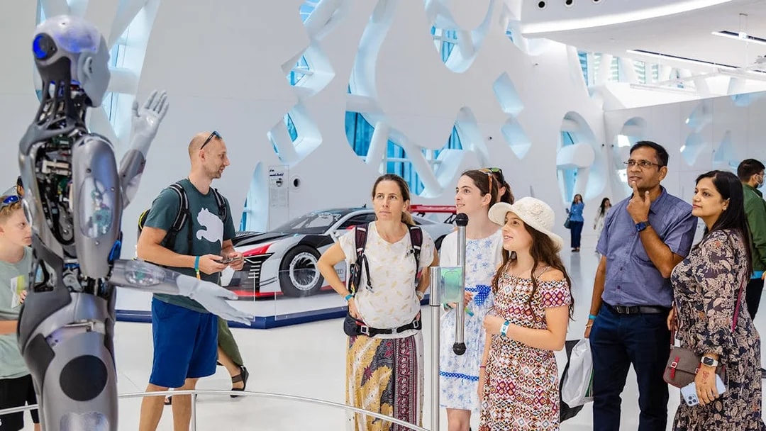 Visitors observing a robot exhibit at the Museum of the Future, Dubai.