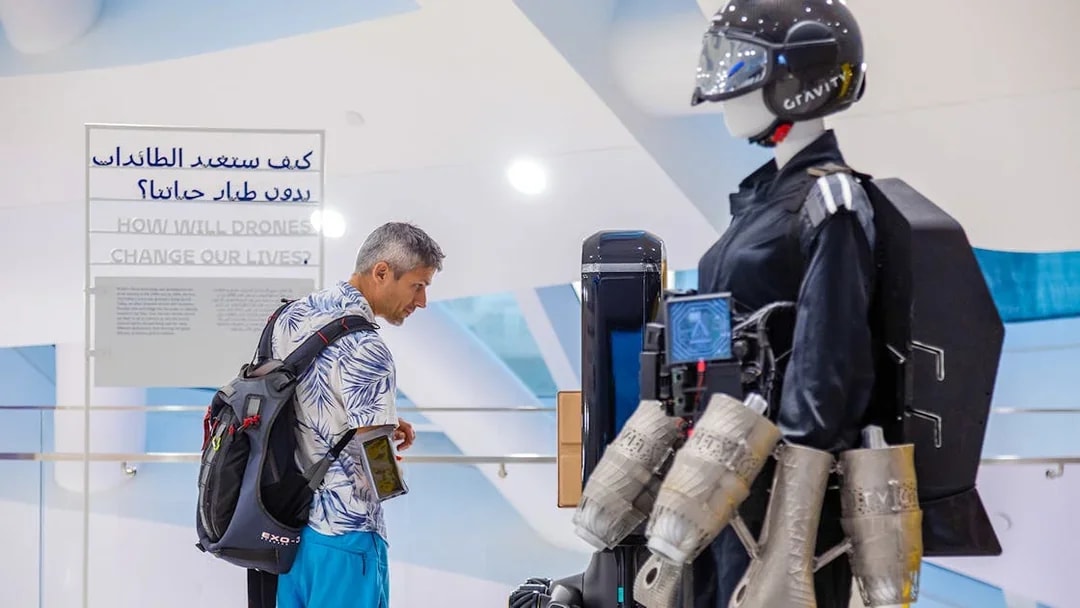 Visitor examining drone exhibit at Museum of the Future, Dubai.