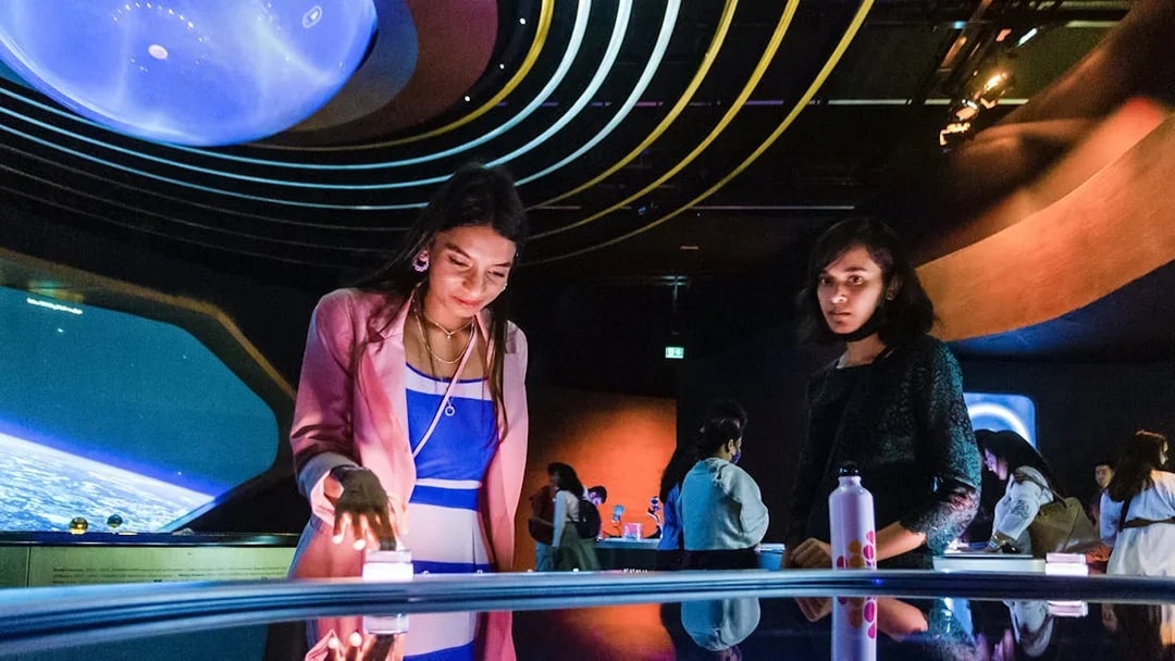 Visitors engaging with interactive exhibits at The OSS Hope, Museum of the Future, Dubai.