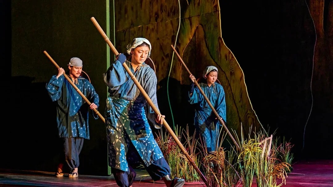 Performers in traditional attire on stage during My Neighbour Totoro show.