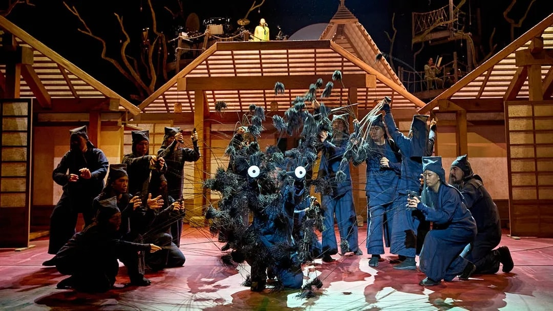 Stage performance of My Neighbour Totoro with actors in traditional Japanese setting.