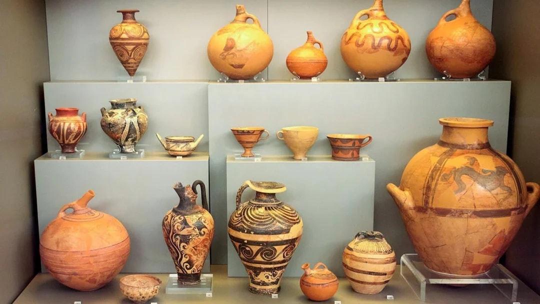 Ancient pottery display at Mycenae archaeological museum.