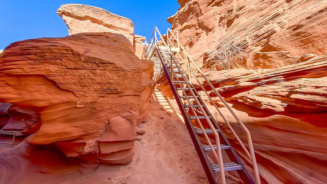 Staircase leading through red rock formations in Antelope Canyon.