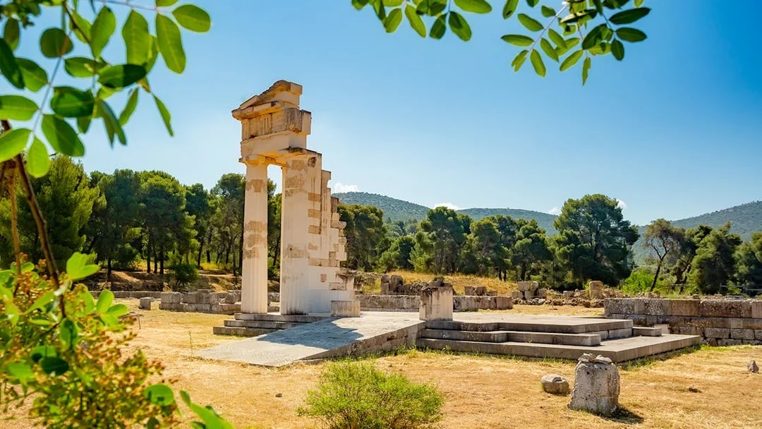Ancient ruins at Epidaurus surrounded by trees, part of Nafplio-Mycenae-Epidaurus Day Tour.