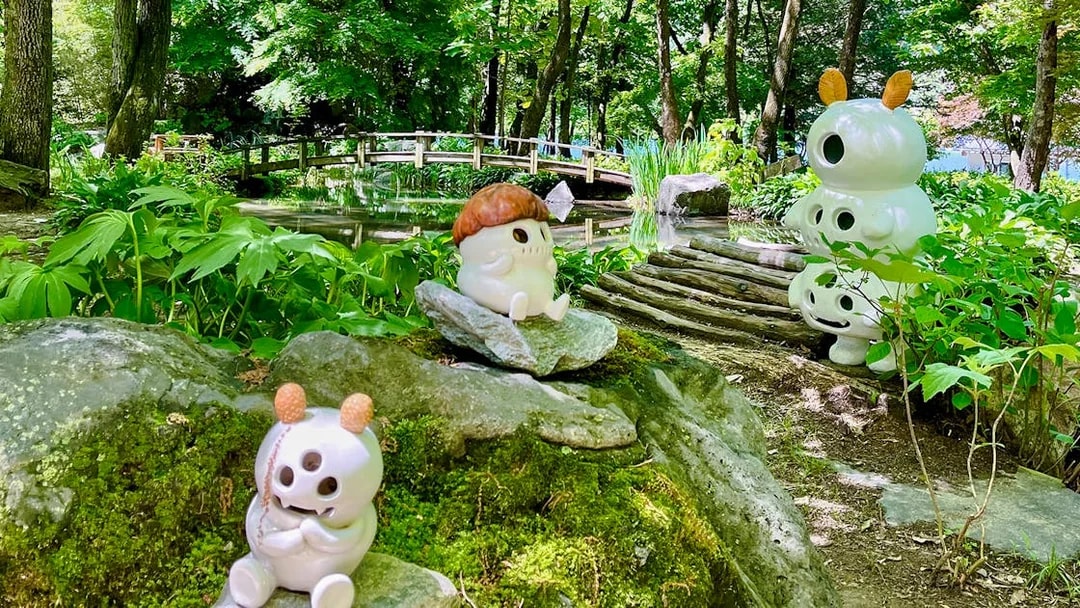 Ceramic figures among bamboo groves and a wooden bridge in Nami Island, South Korea.