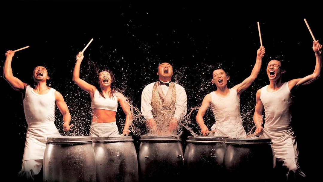 Performers drumming energetically at Jeju Nanta Musical Show.