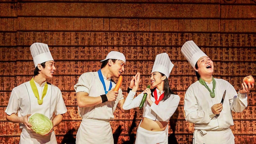 Chefs performing a cooking show with vegetables in Nice.