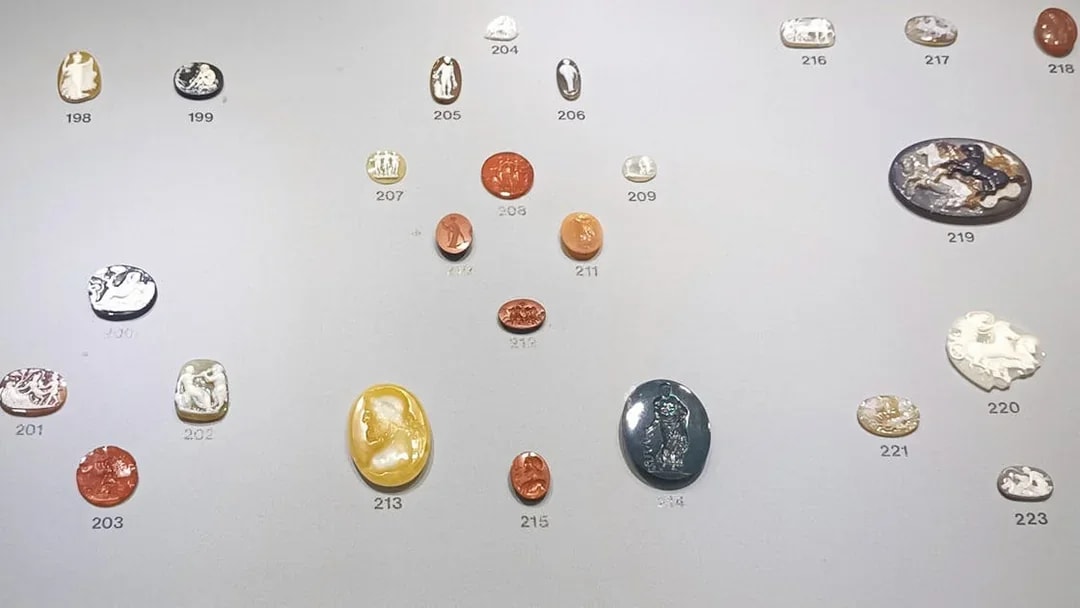 Ancient engraved gems display at Naples National Archaeological Museum.