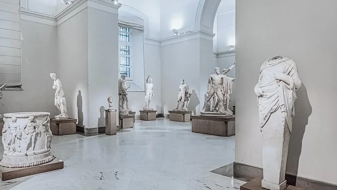 Statues in a gallery at Naples National Archaeological Museum.