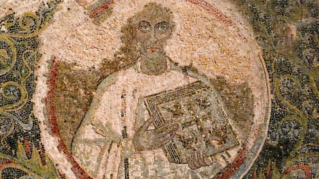 Mosaic artwork in Catacombs of San Gennaro, Naples, depicting a figure holding a book.