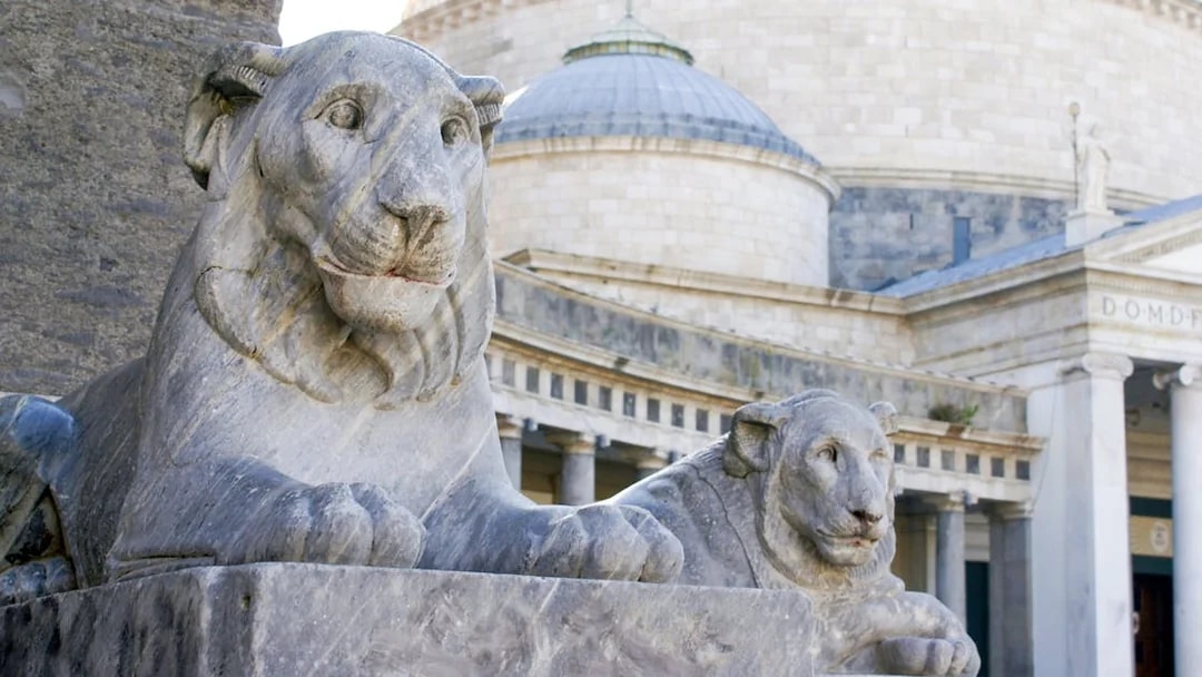 Stone lion statues at Piazza del Plebiscito, Naples, Italy.