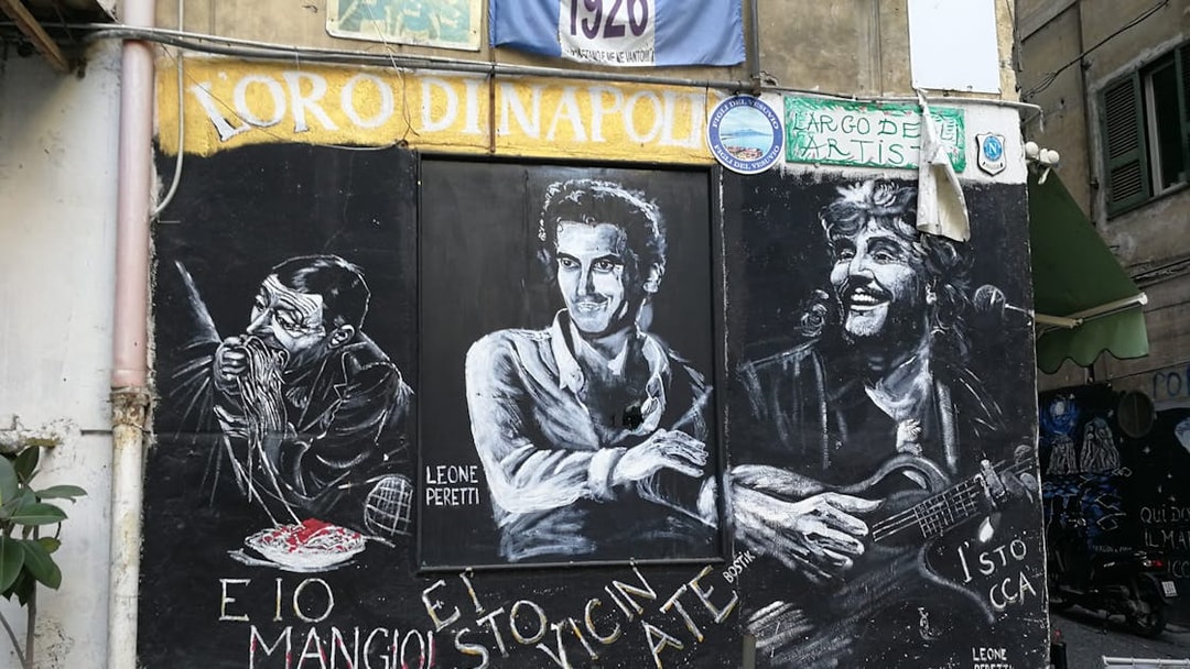 Street mural in Naples featuring Diego Maradona and local cultural icons.