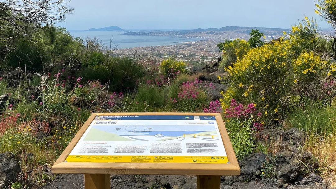 Information board about Mount Vesuvius with view of Naples and surrounding landscape.