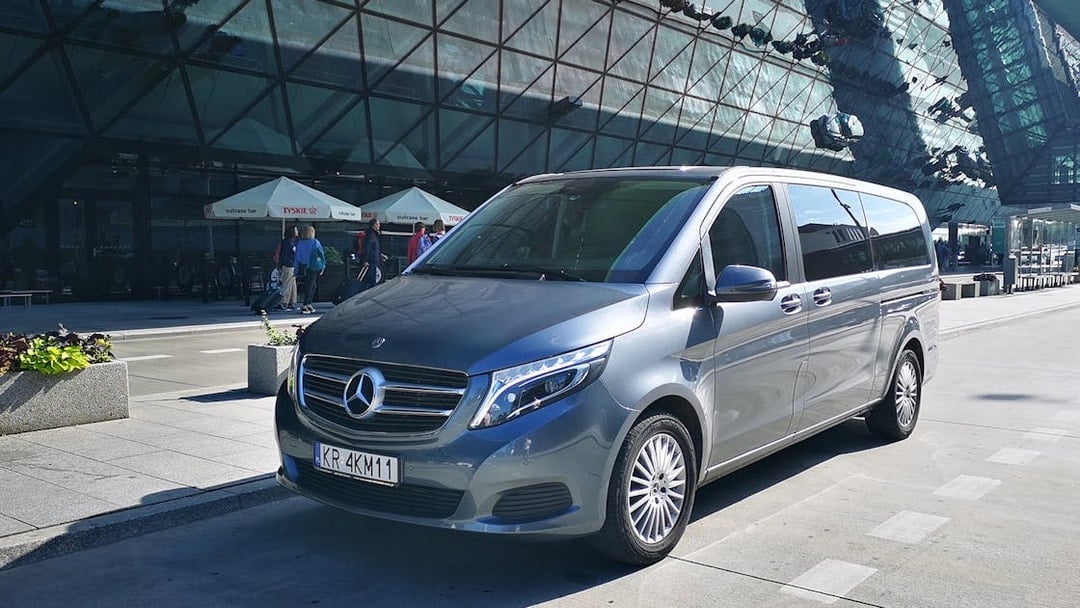 Minivan parked at Gdansk Airport for transfers to Gdynia city.