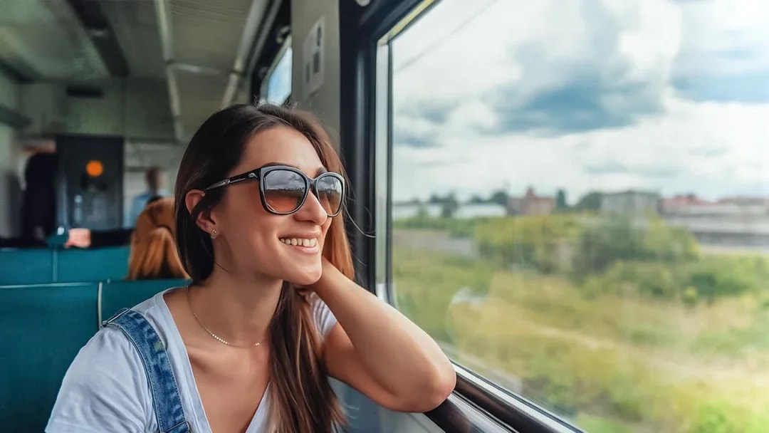 Traveler enjoying scenic view on Naples train tour.