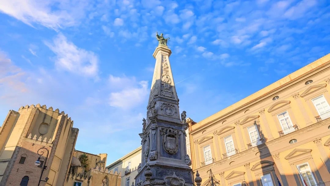 San Domenico Maggiore obelisk and surrounding architecture in Naples, Italy.