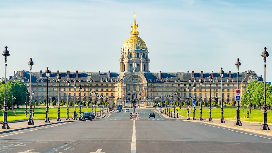 Paris street view with Les Invalides museum in the background.