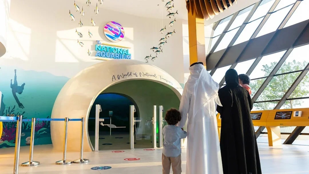 Visitors entering the National Aquarium Abu Dhabi through the main entrance.
