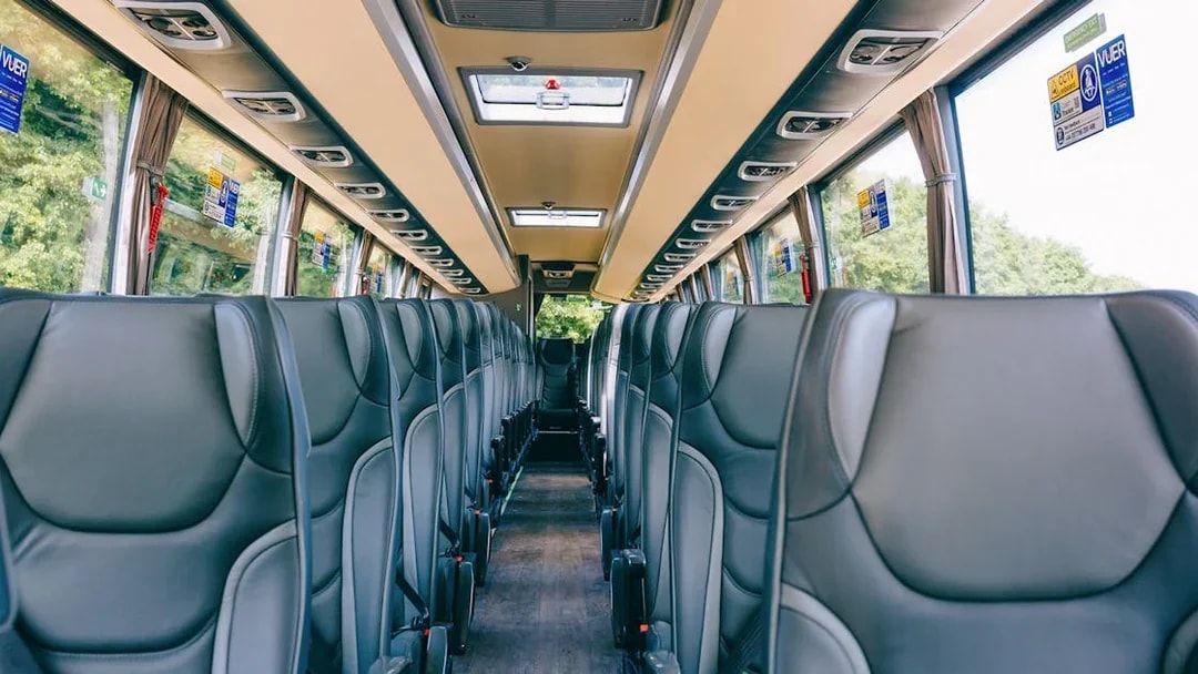 Interior of a tour bus with empty seats, en route to Windsor Castle from Central London.