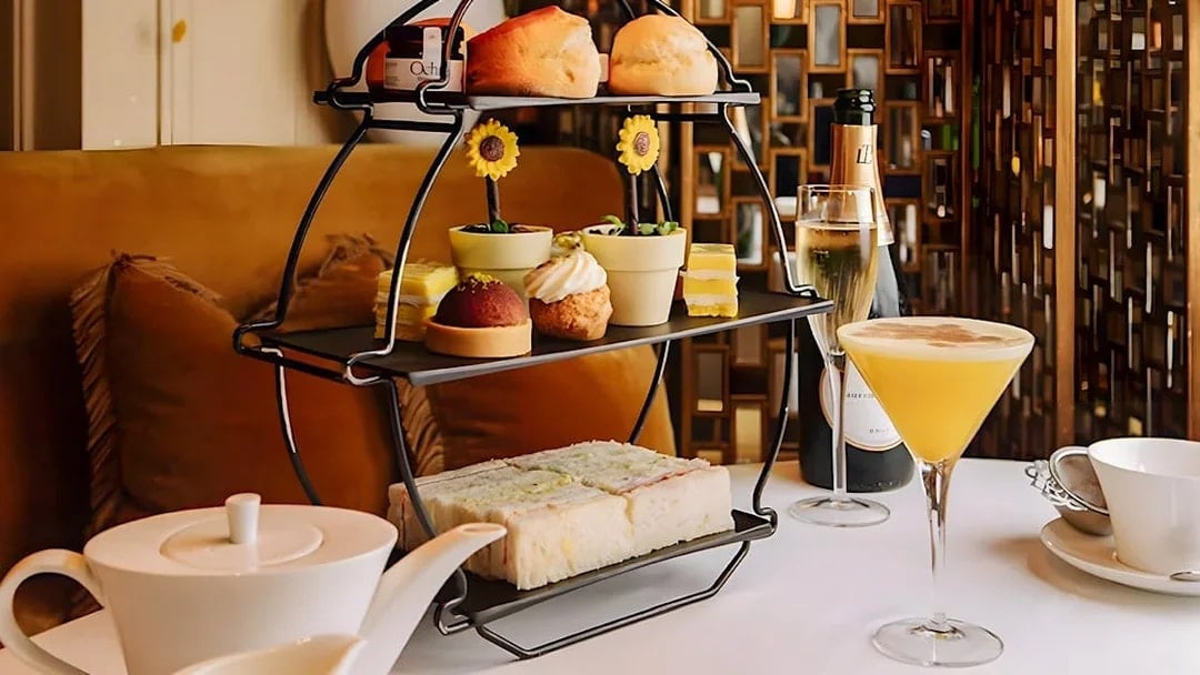 Afternoon tea set with pastries and sandwiches, part of National Gallery Guided Tour.