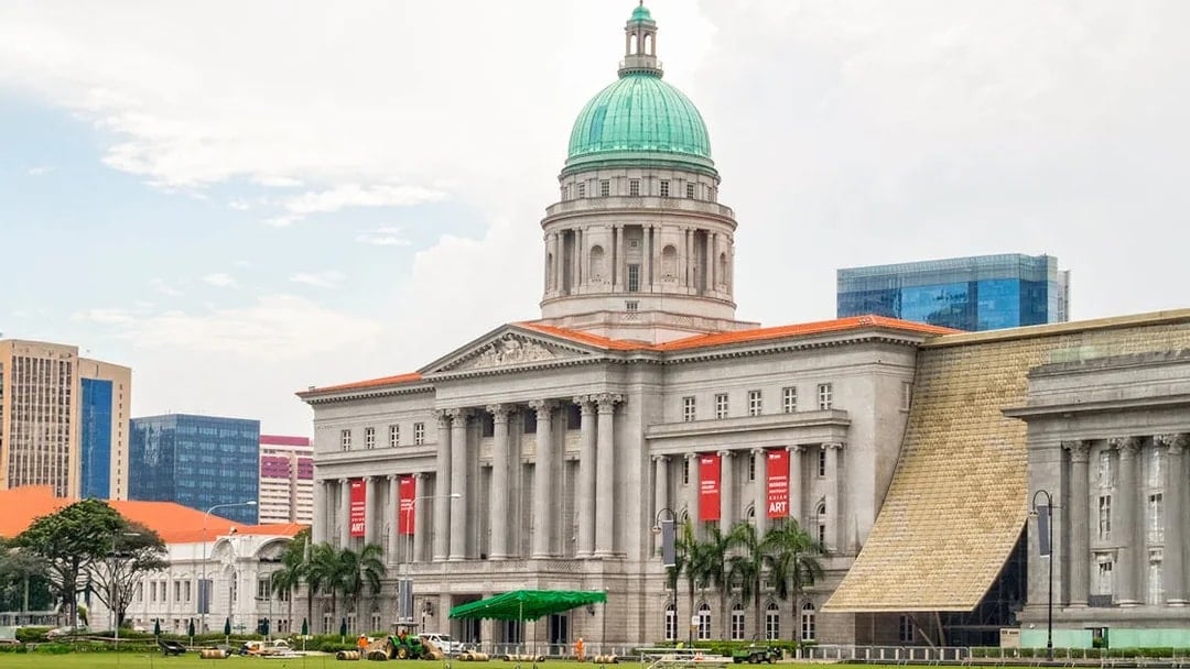 National Gallery Singapore exterior with dome and banners.