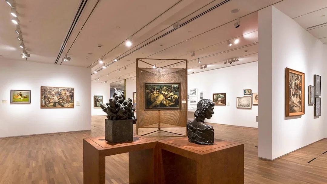 Art sculptures and paintings inside National Gallery Singapore exhibit.