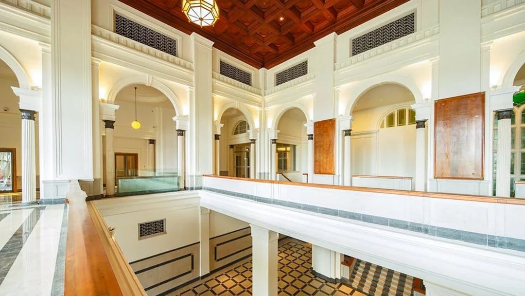 National Gallery Singapore interior with arches and checkered floor.
