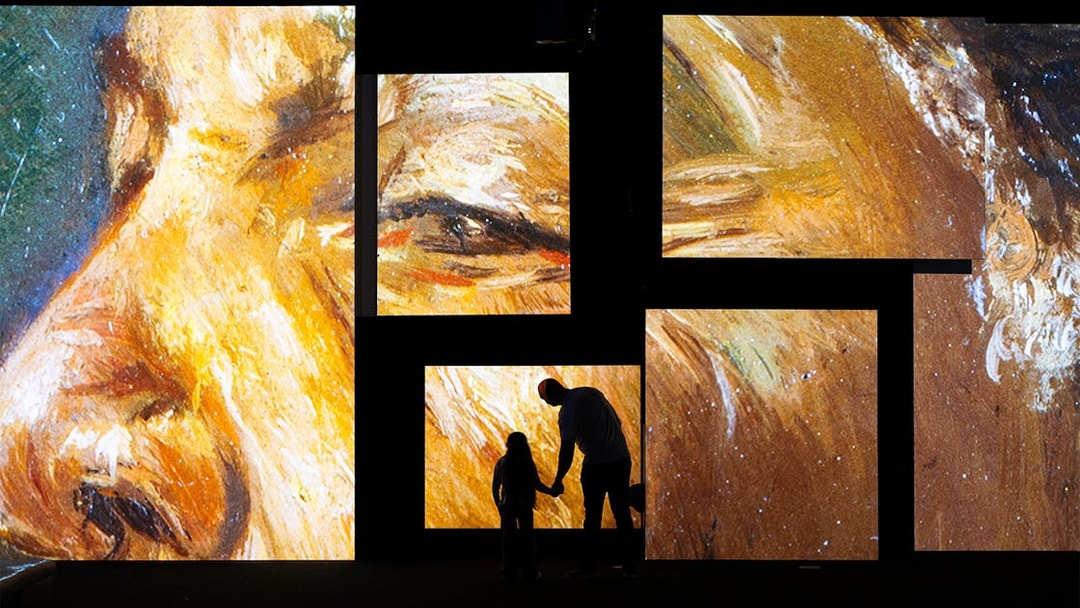 Frameless National Portrait Gallery exhibit with large digital art displays.