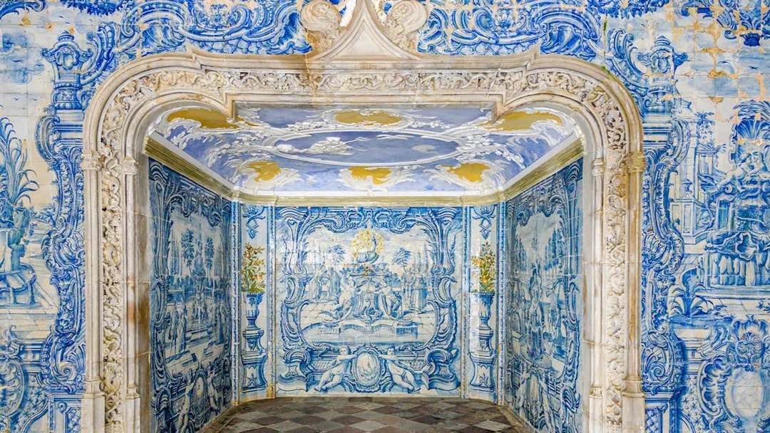 Portuguese ceramic tiles in National Sintra Palace showcasing intricate blue designs.
