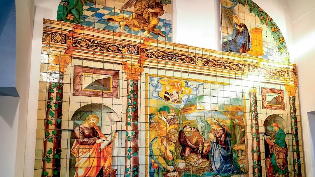 National Tile Museum mural depicting religious scenes in Lisbon, Portugal.