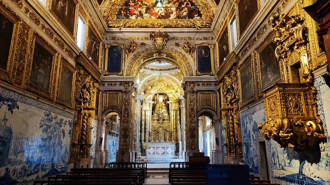 Main altar of National Tile Museum in Lisbon, featuring ornate gold detailing and azulejo tiles.