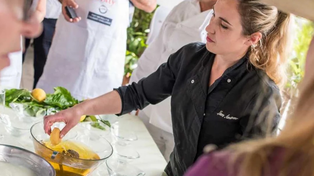 Chef preparing lemon dish at Neapolitan cooking school in Sorrento.