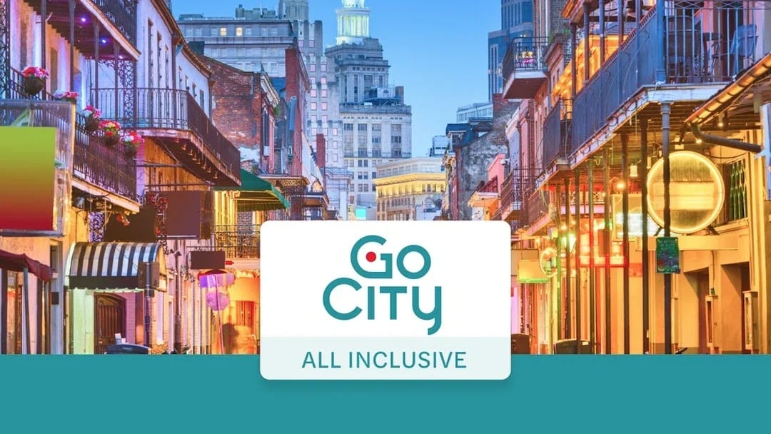 Bourbon Street in New Orleans with vibrant lights and historic architecture.