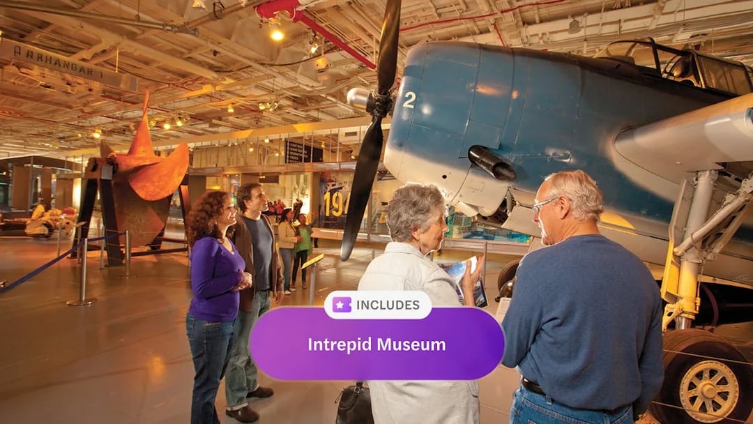 Visitors exploring aircraft exhibit at Intrepid Museum, New York City.
