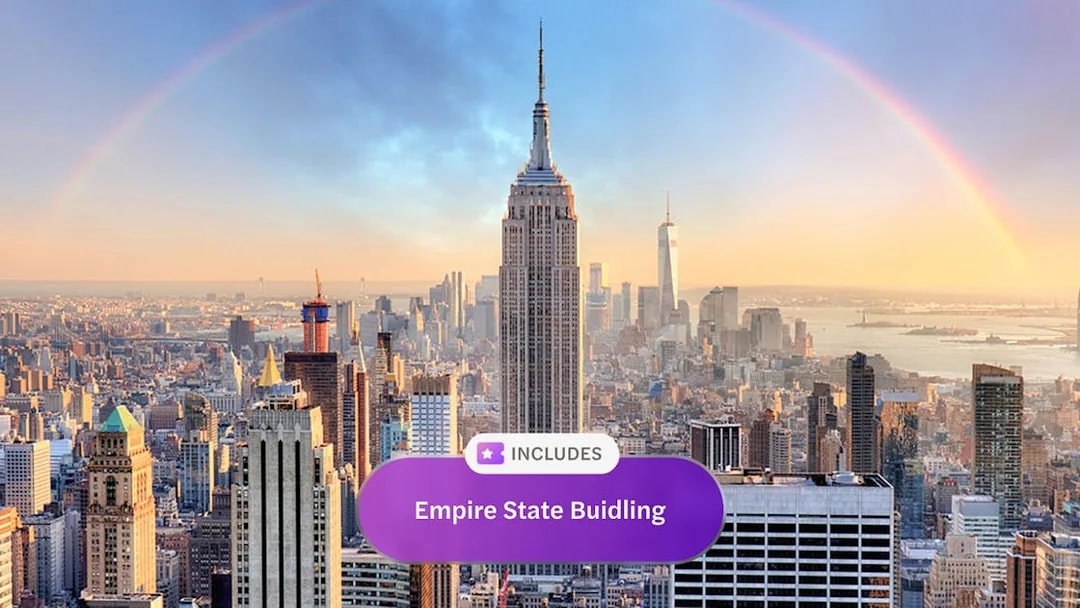 Empire State Building with city skyline and rainbow in New York City.