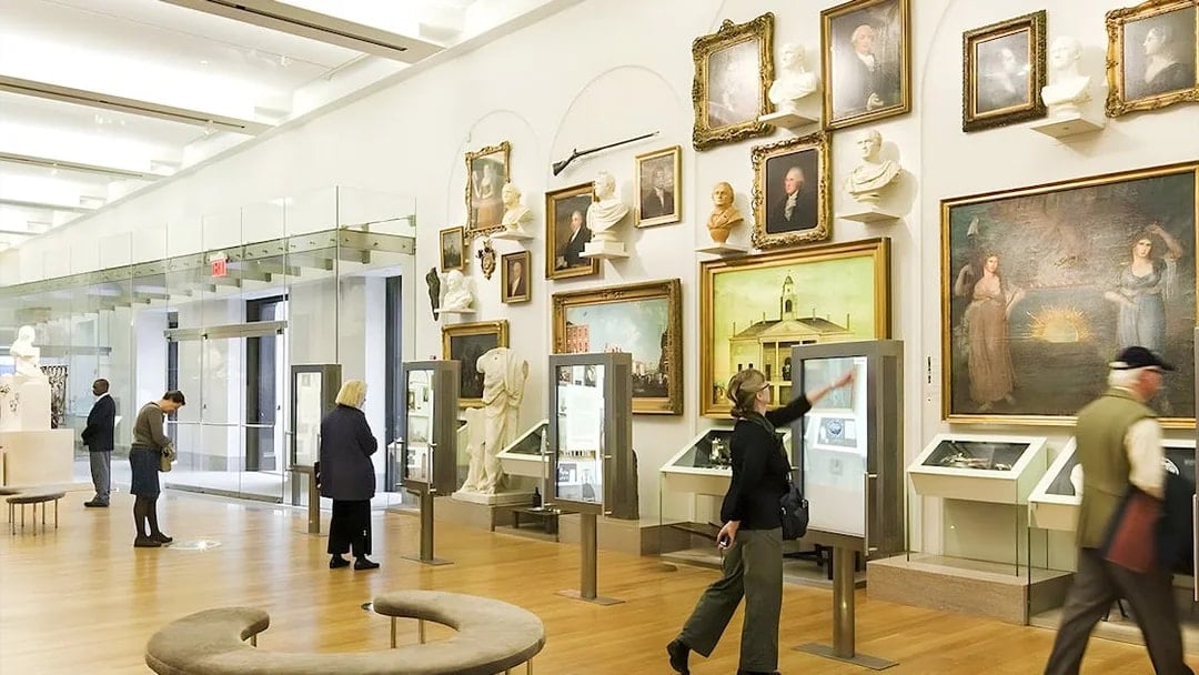 Visitors exploring exhibits at New York Historical Society.
