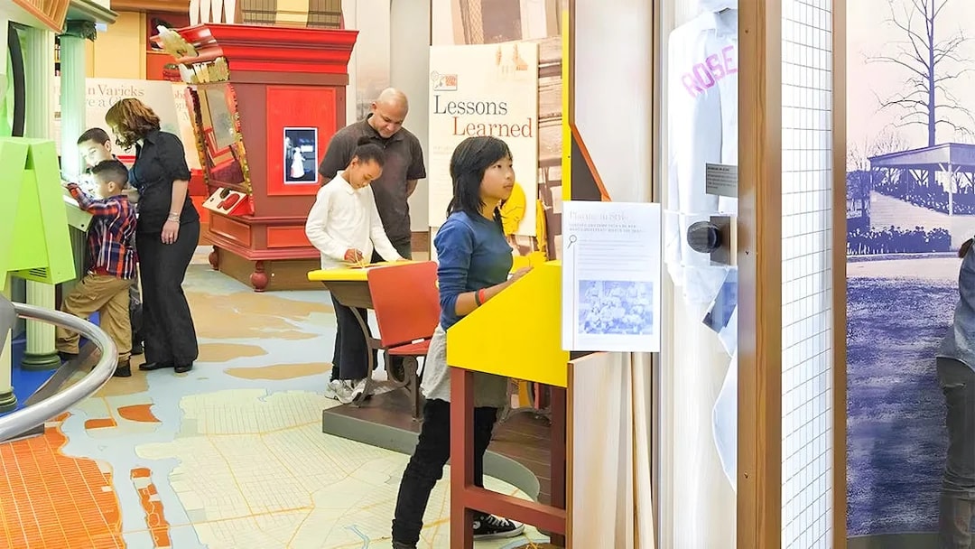 Visitors exploring exhibits at New York Historical Society.