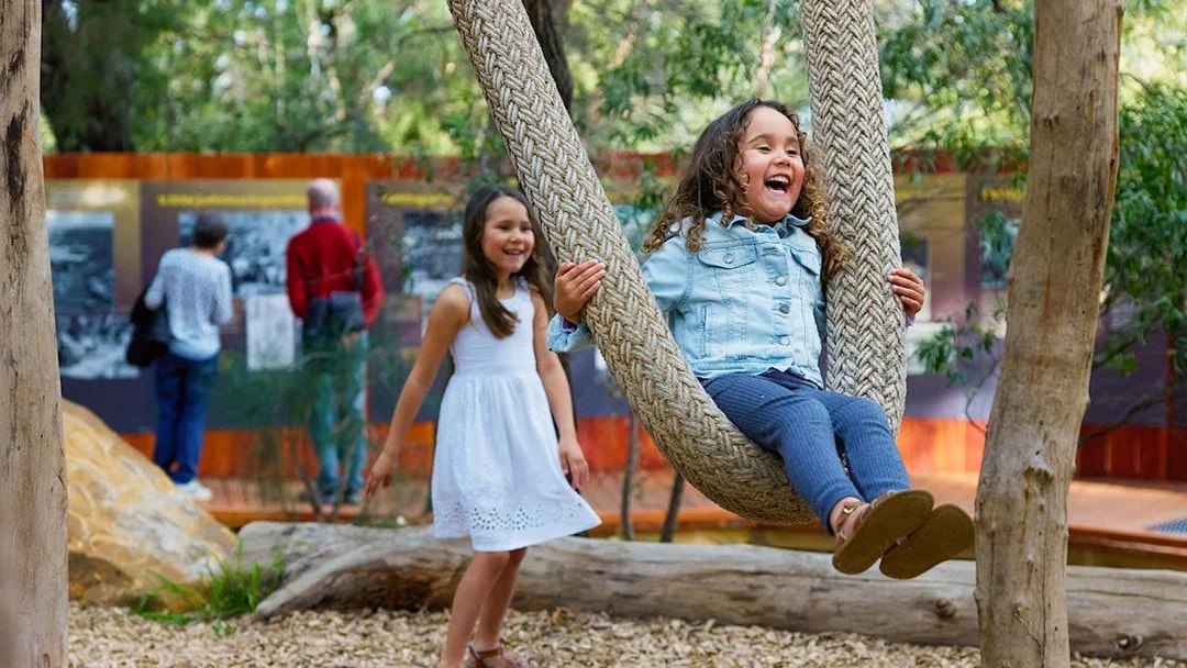 Children playing on a rope swing at Ngilgi Cave Ancient Lands Experience.
