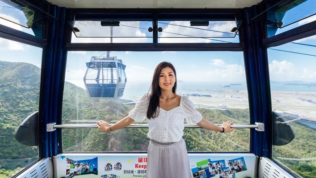 Ngong Ping Cable Car interior with view of Lantau Island, Hong Kong.