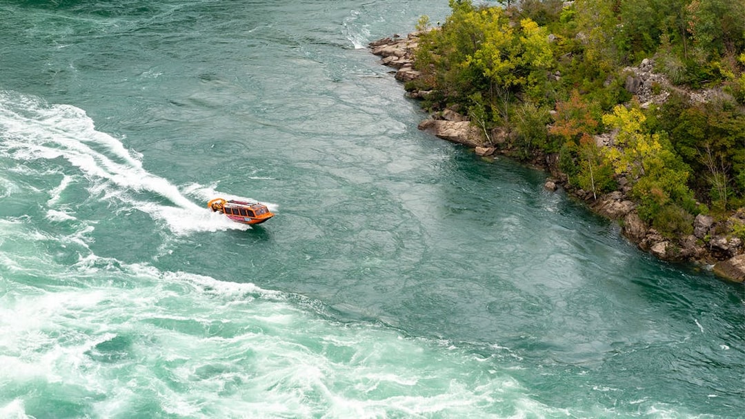Jet boat navigating rapids in Niagara Gorge, Canada.