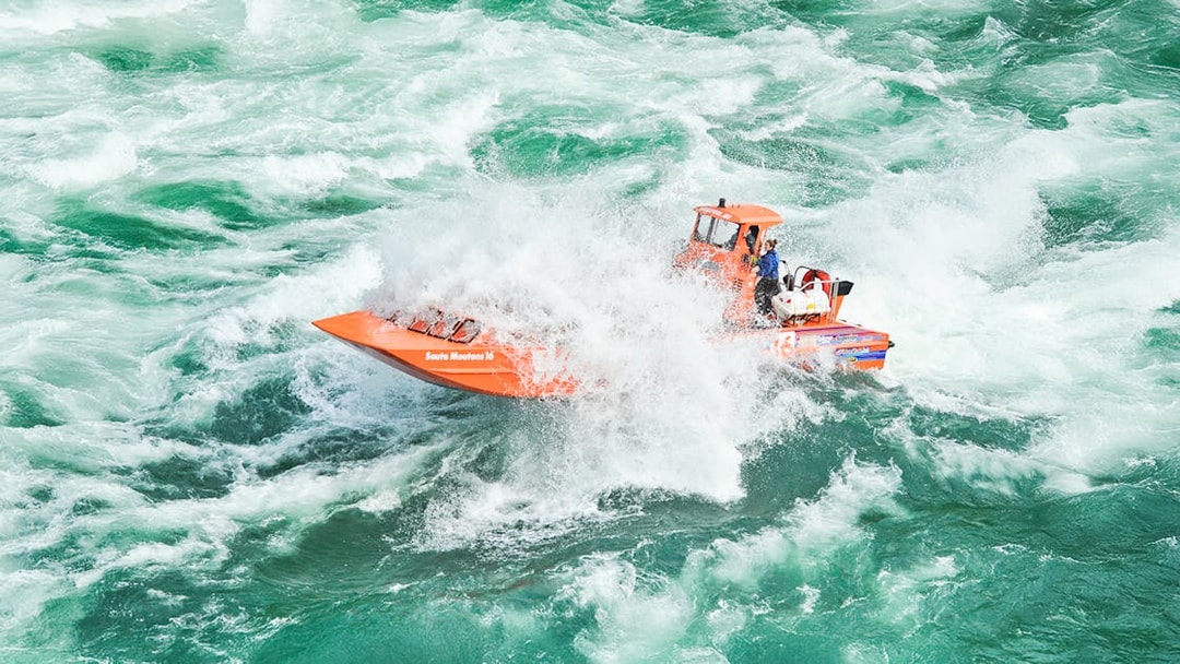 Whirlpool Jet Boat navigating rapids in Niagara Gorge, Canada.