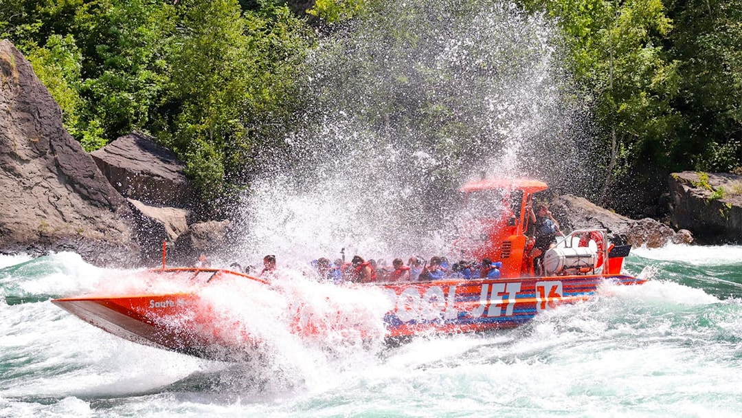 Guests enjoying a thrilling Whirlpool Jet Boat ride in the Niagara Gorge, Canada.