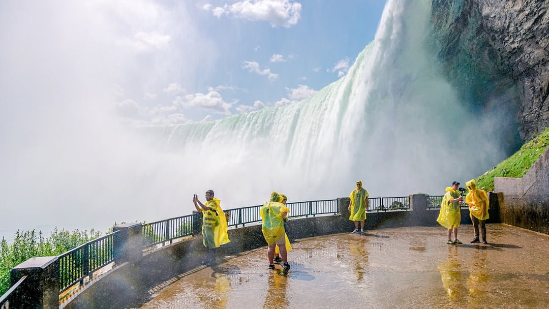Visitors in yellow ponchos at Journey Behind the Falls, Niagara Falls.