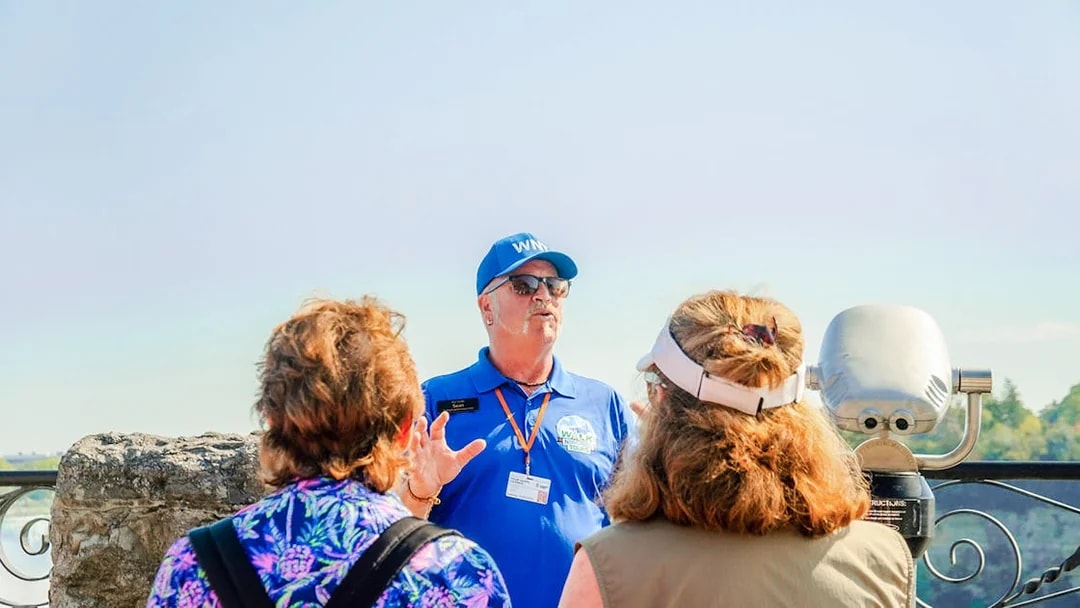 Tour guide leading a group at Niagara Falls, Canada.